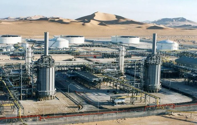 Industrial processing facilities, storage tanks and piping in a desert setting